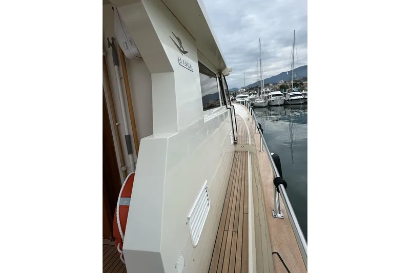  Yacht Photos Pics Hampton ALASKA 17 yacht, 2003 model, docked in a marina with cloudy skies.