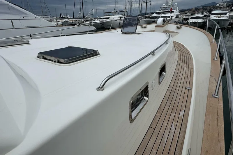  Yacht Photos Pics 2003 Hampton ALASKA 17 yacht docked, showcasing sleek deck design and modern features.