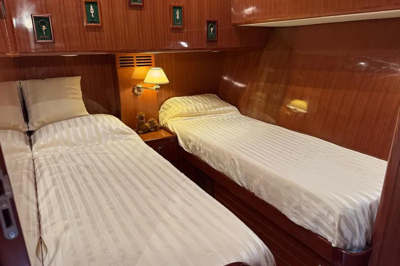  Yacht Photos Pics Luxurious twin cabin in 2003 Hampton ALASKA 17 yacht with elegant wood paneling.