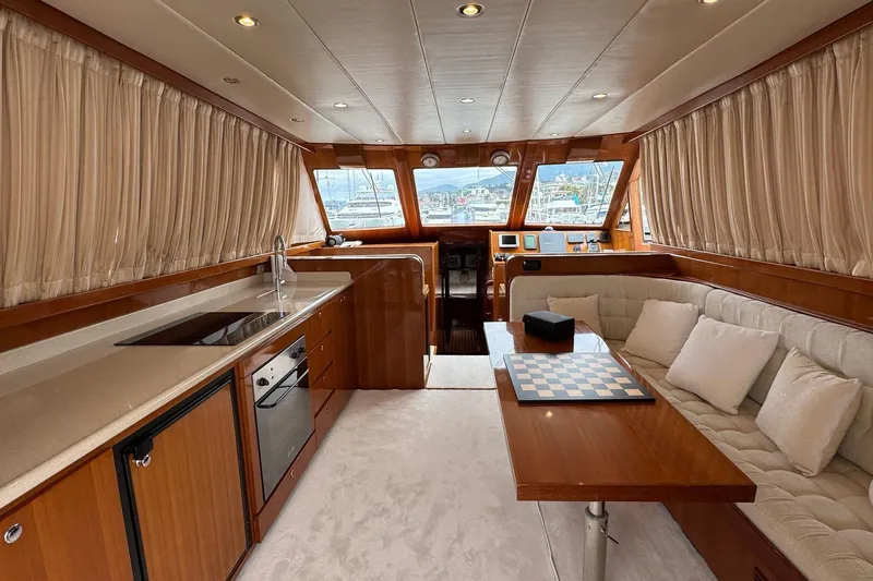  Yacht Photos Pics Luxurious interior of 2003 Hampton ALASKA 17 yacht with kitchen and seating area.