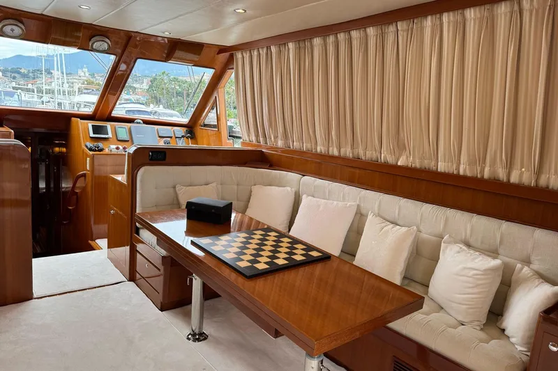  Yacht Photos Pics Luxurious interior of 2003 Hampton ALASKA 17 yacht with chessboard on table.