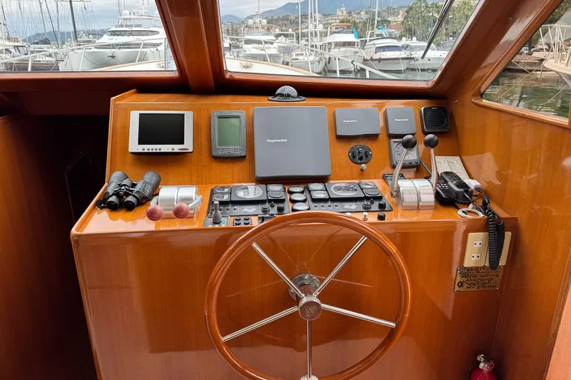  Yacht Photos Pics Helm of 2003 Hampton ALASKA 17 yacht with navigation equipment and steering wheel.