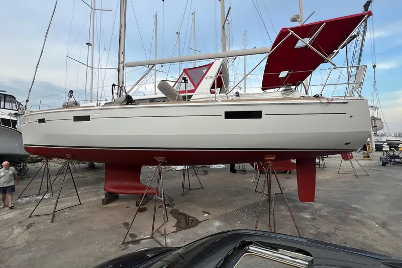  Yacht Photos Pics 2013 Beneteau Oceanis 45 sailboat on stands, red hull, marina setting.
