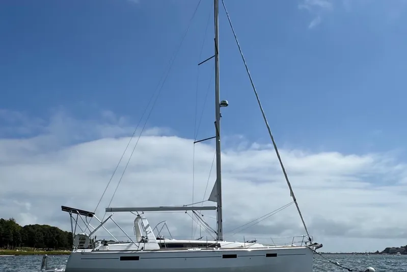  Yacht Photos Pics 2013 Beneteau Oceanis 45 sailboat on water under clear blue sky.