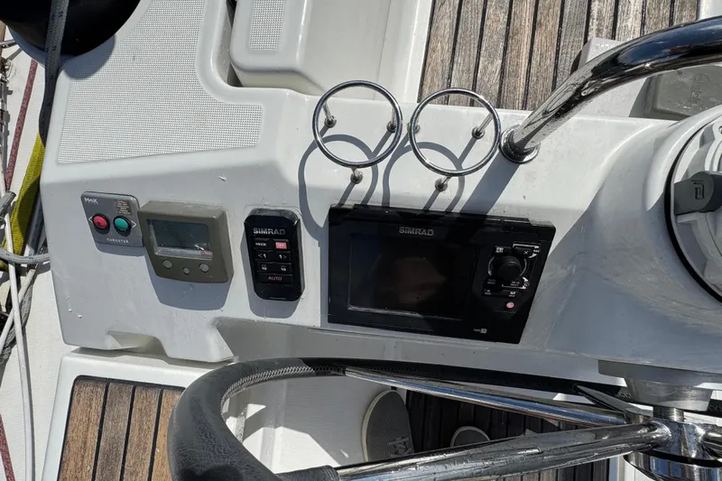 Yacht Photos Pics Beneteau Oceanis 45 yacht helm with Simrad controls and cup holders, 2013 model.