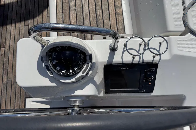  Yacht Photos Pics Cockpit of 2013 Beneteau Oceanis 45 with compass and Simrad navigation system.