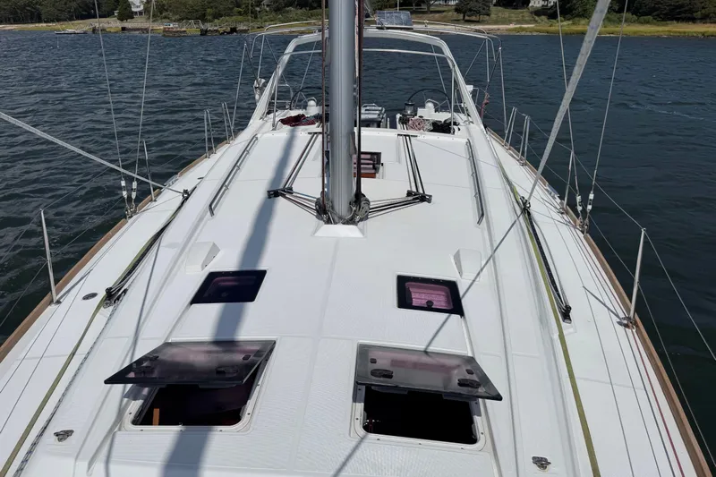  Yacht Photos Pics 2013 Beneteau Oceanis 45 sailboat deck view on calm water.
