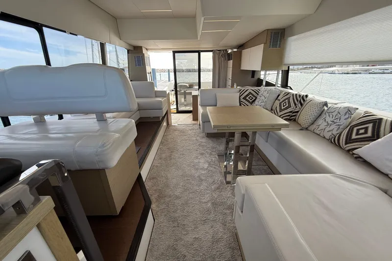  Yacht Photos Pics Luxurious interior of a 2020 Prestige 520 yacht with elegant seating and scenic ocean views.