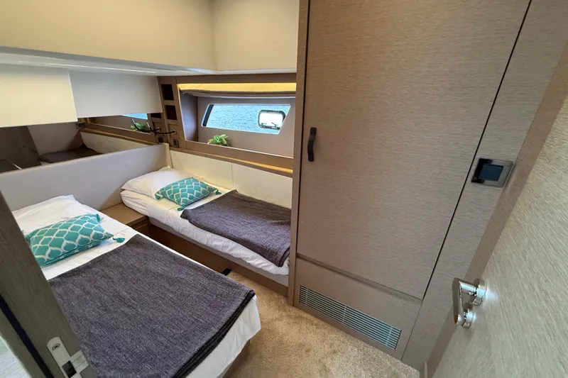  Yacht Photos Pics Luxurious twin cabin in 2020 Prestige 520 yacht, featuring modern decor and ocean view.