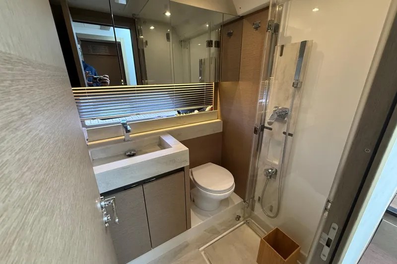  Yacht Photos Pics Modern bathroom in 2020 Prestige 520 yacht with sleek fixtures and glass shower.