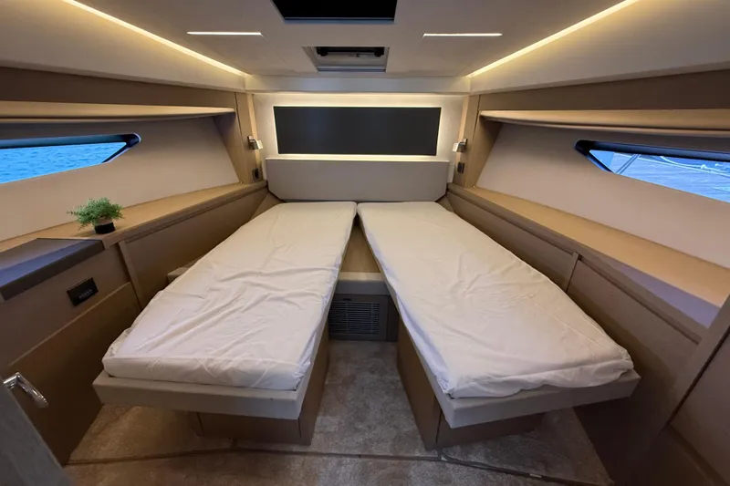  Yacht Photos Pics Luxurious 2020 Prestige 520 yacht cabin with twin beds and modern lighting.