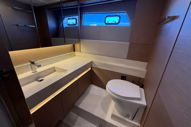  Yacht Photos Pics Luxurious bathroom in 2020 Prestige 520 yacht with modern fixtures and elegant design.