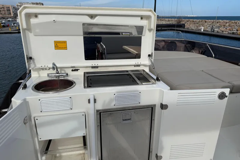  Yacht Photos Pics Outdoor kitchen on 2020 Prestige 520 yacht with sink and grill.