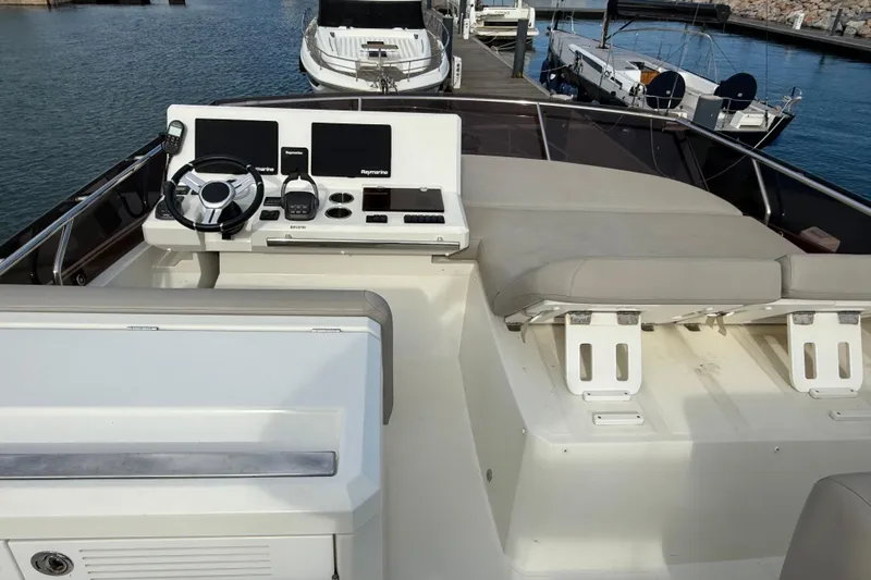  Yacht Photos Pics Prestige 520 yacht helm station, 2020 model, featuring modern navigation equipment and seating.