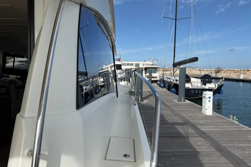  Yacht Photos Pics Luxury Prestige 520 yacht docked at marina, showcasing sleek design and modern features.