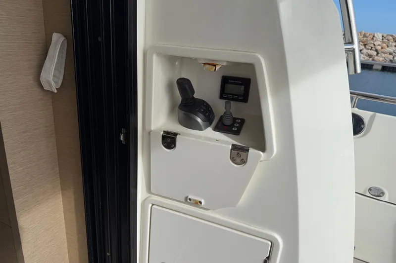  Yacht Photos Pics Control panel of a 2020 Prestige 520 yacht, featuring joystick and display.