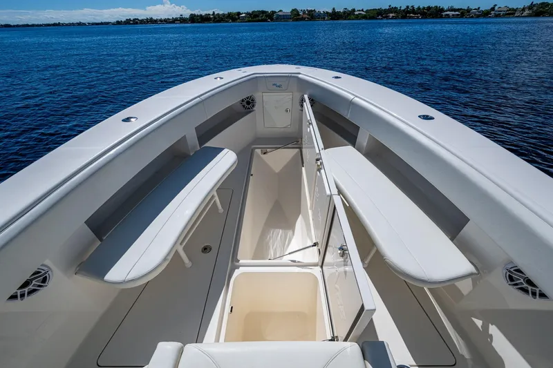 Da Bubbs Yacht Photos Pics 2024 SeaVee 322z boat interior with seating and storage, on calm blue water.