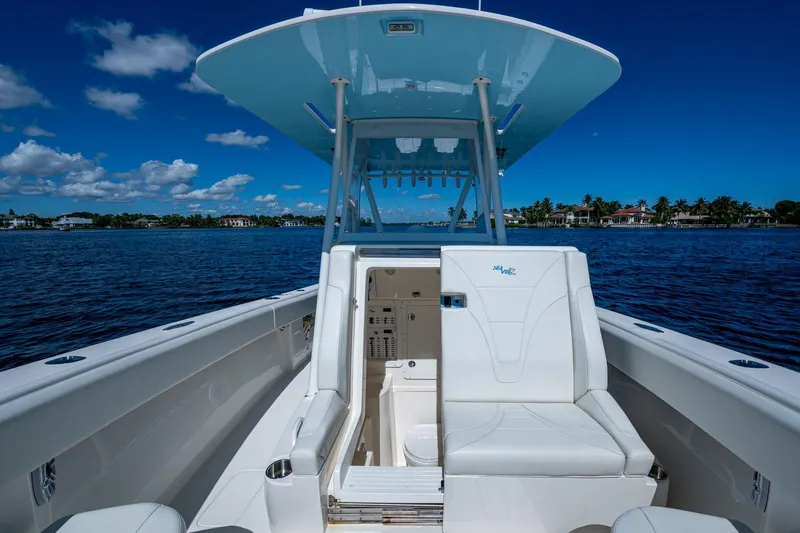 Da Bubbs Yacht Photos Pics 2024 SeaVee 322z boat interior with seating, under a clear blue sky.