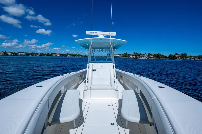 Da Bubbs Yacht Photos Pics 2024 SeaVee 322z boat on calm water under clear blue sky.