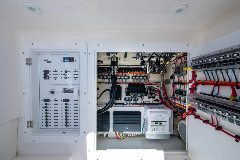 Da Bubbs Yacht Photos Pics Electrical control panel of 2024 SeaVee 322z boat, showcasing wiring and circuit systems.