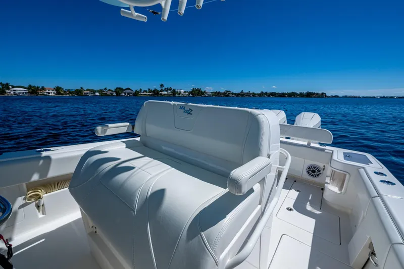 Da Bubbs Yacht Photos Pics 2024 SeaVee 322z boat interior with white seating, overlooking calm blue waters.