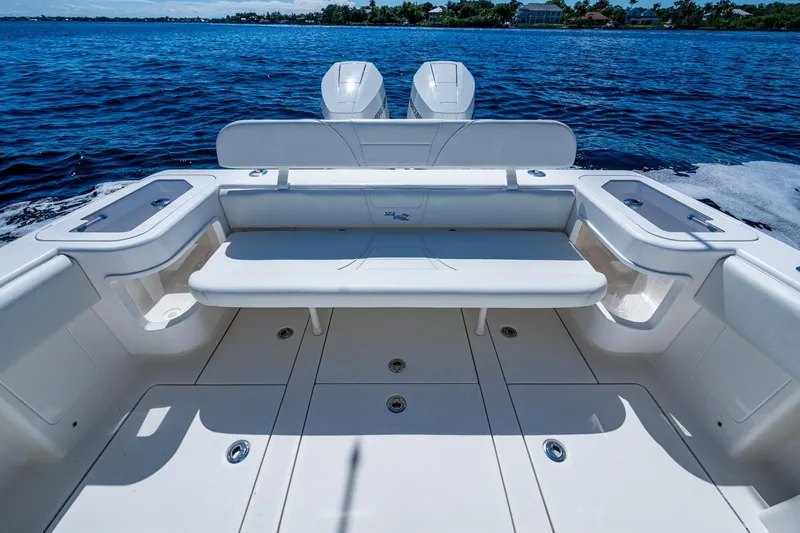 Da Bubbs Yacht Photos Pics 2024 SeaVee 322z boat deck with seating, on a calm blue ocean.