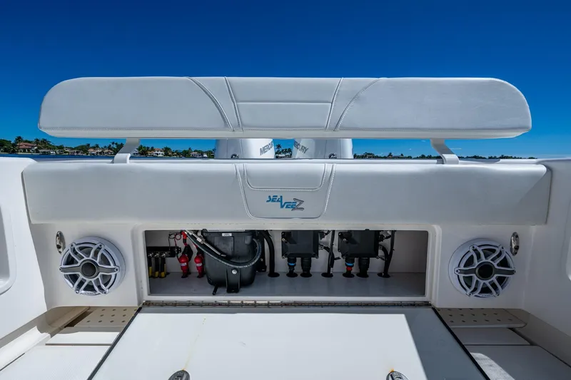 Da Bubbs Yacht Photos Pics 2024 SeaVee 322z boat interior with speakers and storage compartment, under clear blue sky.