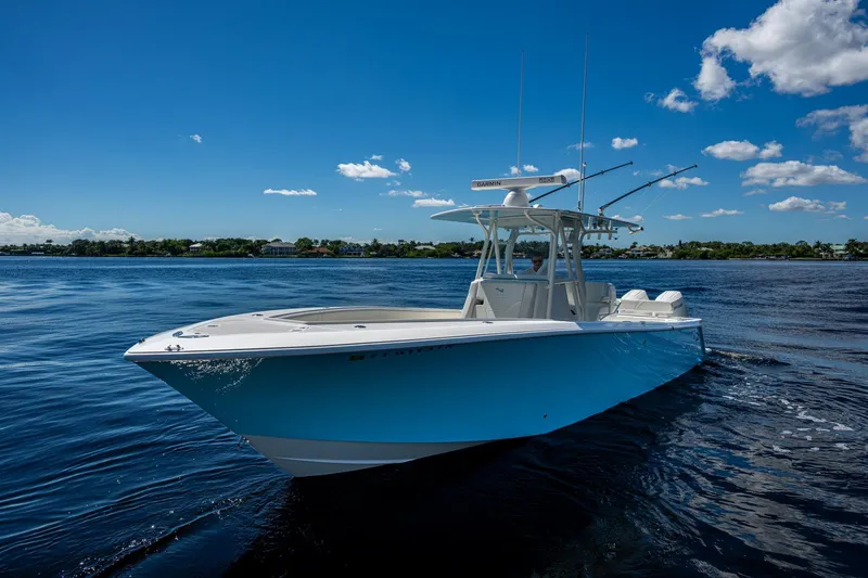 Da Bubbs Yacht Photos Pics 2024 SeaVee 322z boat on calm water under a clear blue sky.