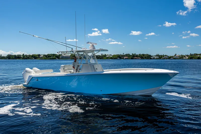Da Bubbs Yacht Photos Pics 2024 SeaVee 322z boat cruising on a sunny day, blue water background.