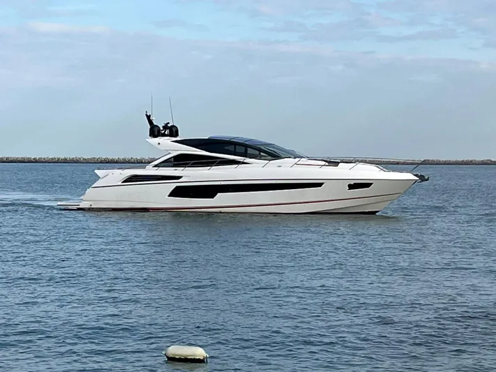  Yacht Photos Pics 2014 Sunseeker 68 Predator luxury yacht cruising on calm waters.