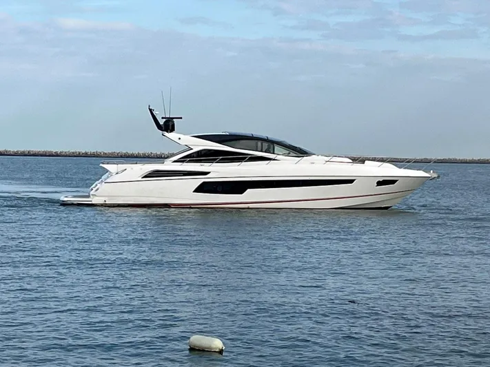  Yacht Photos Pics 2014 Sunseeker 68 Predator yacht cruising on calm waters.