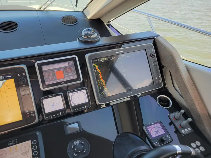  Yacht Photos Pics Control panel of a 2014 Sunseeker 68 Predator yacht with navigation screens.