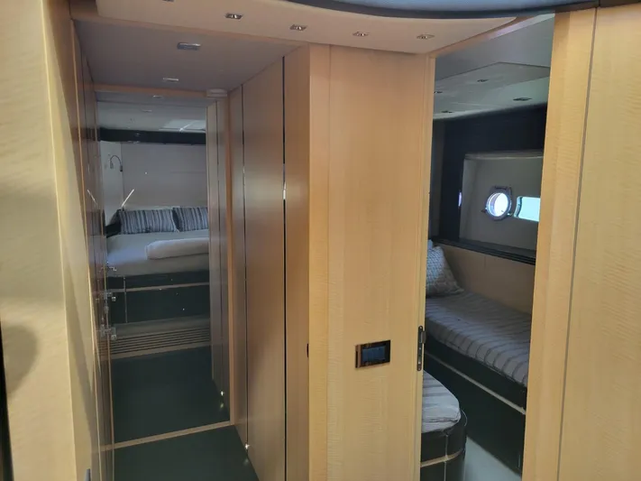  Yacht Photos Pics Interior cabin of 2014 Sunseeker 68 Predator yacht with modern wood paneling and cozy sleeping quarters.