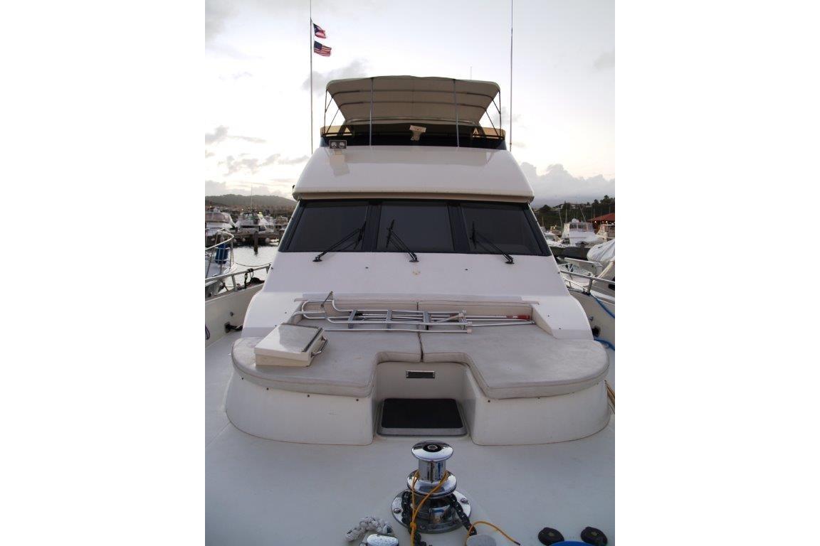 1991 Viking 65 Cockpit yacht docked at marina, featuring spacious deck and flybridge.