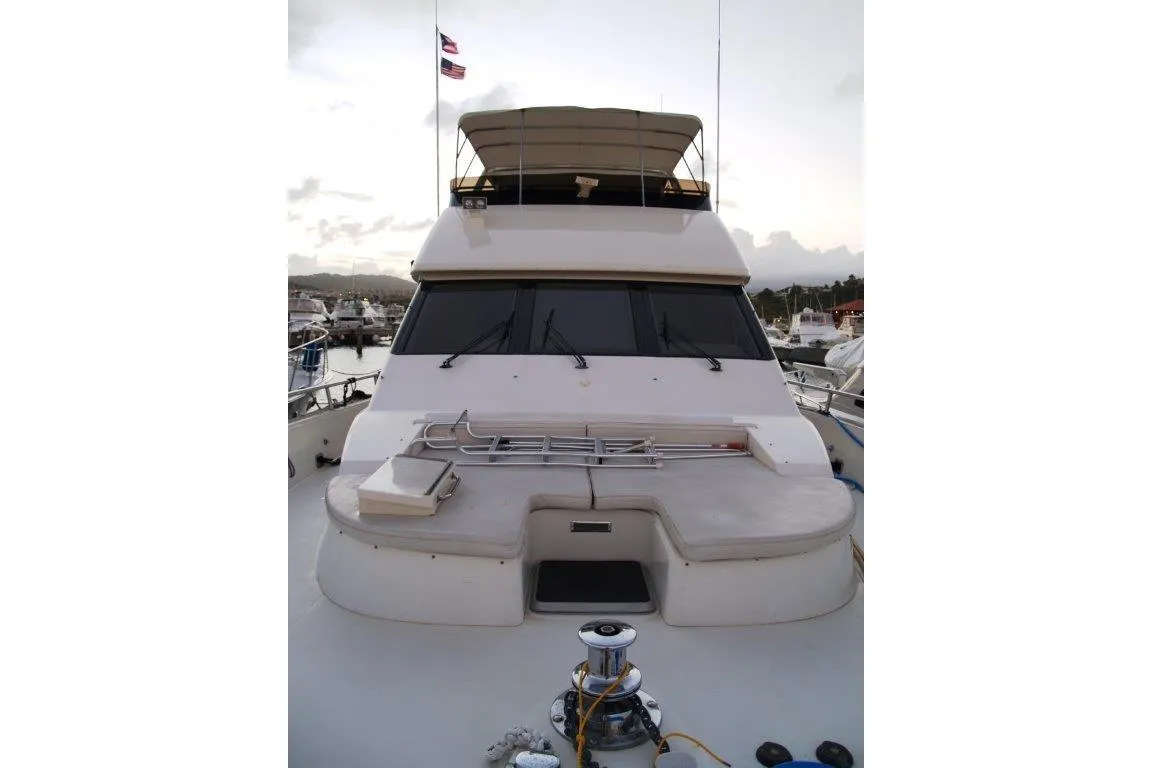1991 Viking 65 Cockpit yacht docked at marina, featuring spacious deck and flybridge.