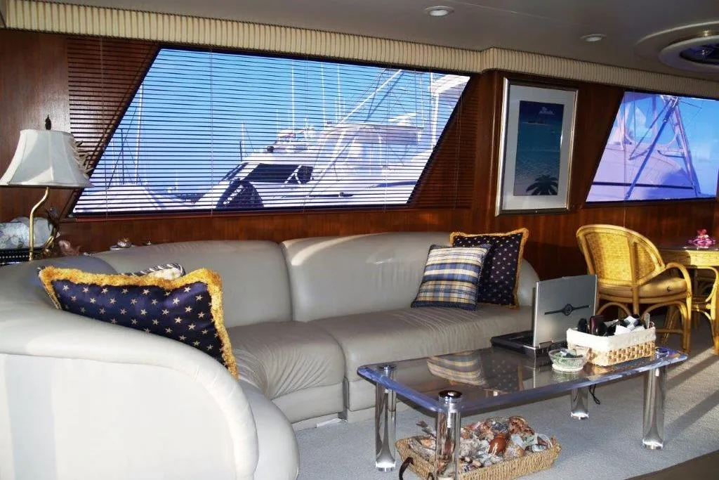 Luxurious interior of a 1991 Viking 65 Cockpit yacht with elegant seating and decor.