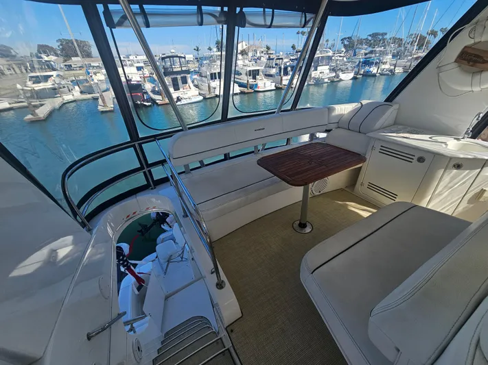 Captain's Quarters Yacht Photos Pics Luxurious 2012 Silverton West Coast Edition yacht interior with marina view.