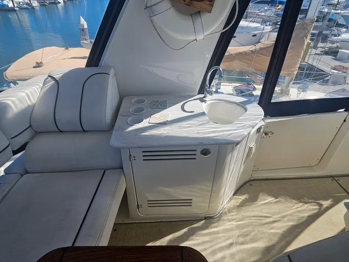 Captain's Quarters Yacht Photos Pics Interior of 2012 Silverton West Coast Edition yacht with seating and sink area.