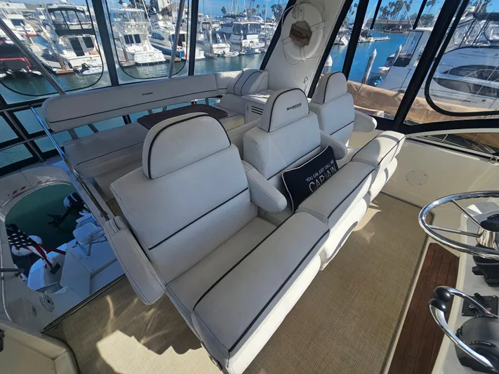 Captain's Quarters Yacht Photos Pics Interior of 2012 Silverton West Coast Edition yacht with white seating and marina view.