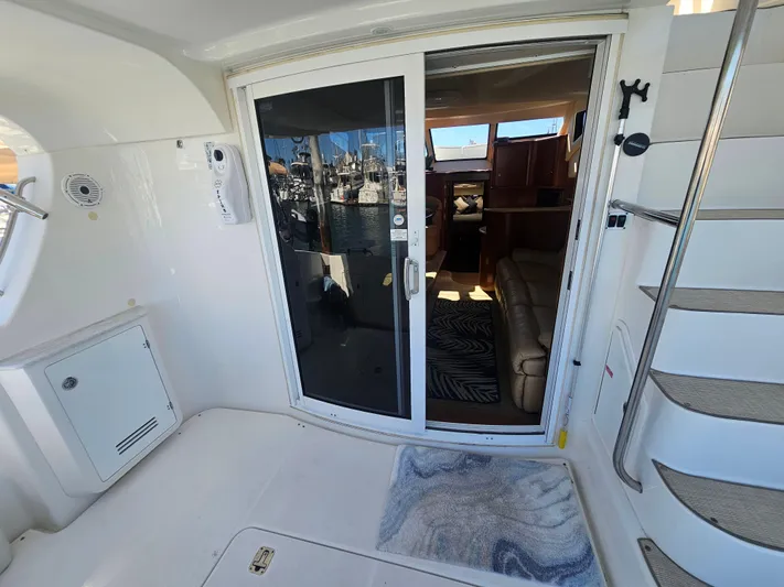 Captain's Quarters Yacht Photos Pics Interior view of 2012 Silverton West Coast Edition yacht with sliding glass door.