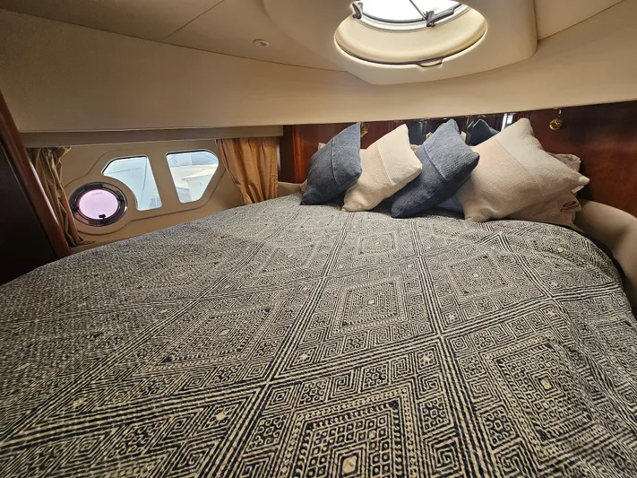 Captain's Quarters Yacht Photos Pics Luxurious cabin interior of 2012 Silverton West Coast Edition yacht with patterned bedding.