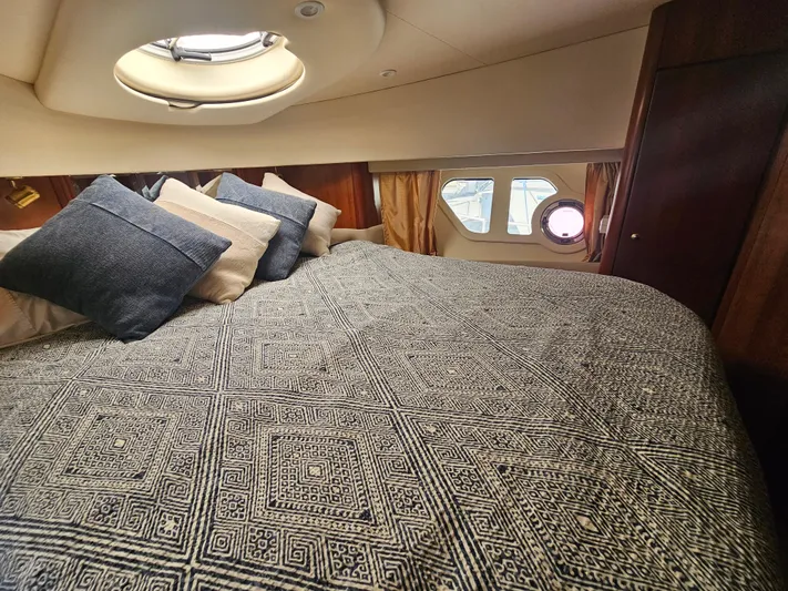 Captain's Quarters Yacht Photos Pics Luxurious cabin interior of 2012 Silverton West Coast Edition yacht with patterned bedding.