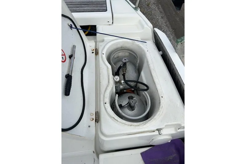 Urkab Yacht Photos Pics Storage compartment on a 2018 Jeanneau Sun Odyssey 449 sailboat, featuring gas cylinders.