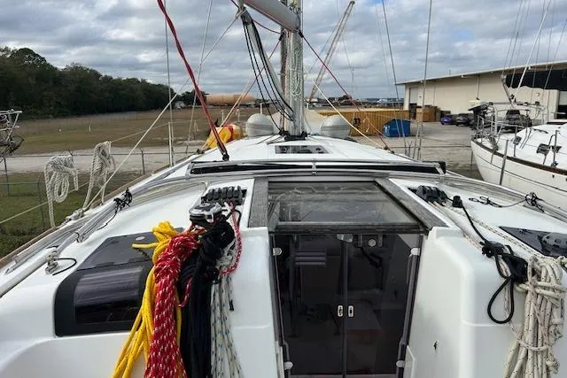 Urkab Yacht Photos Pics 2018 Jeanneau Sun Odyssey 449 sailboat deck with ropes and hatch, docked outdoors.