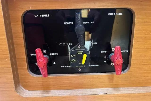Urkab Yacht Photos Pics Control panel of a 2018 Jeanneau Sun Odyssey 449 sailboat, featuring battery and breaker switches.