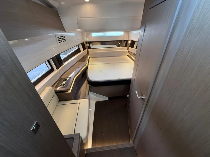  Yacht Photos Pics 2023 Wellcraft 38 Explorer cabin interior with modern design and comfortable seating.