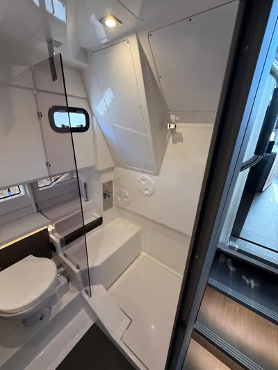  Yacht Photos Pics 2023 Wellcraft 38 Explorer bathroom interior with modern fixtures and sleek design.