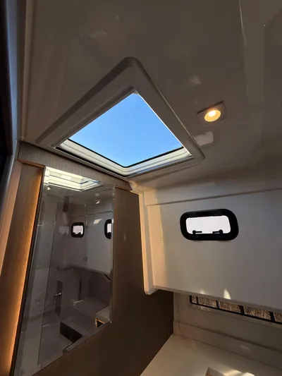  Yacht Photos Pics Interior view of 2023 Wellcraft 38 Explorer with skylight and modern design.