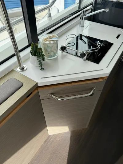  Yacht Photos Pics Modern kitchen area on 2023 Wellcraft 38 Explorer yacht with sleek design.