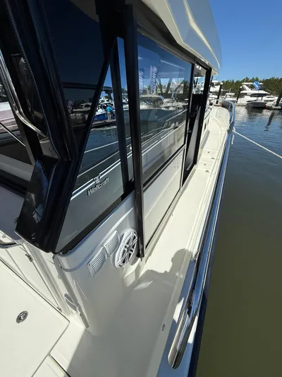  Yacht Photos Pics 2023 Wellcraft 38 Explorer boat docked, showcasing sleek design and modern features.